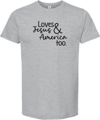Light gray t-shirt with text 'Loves Jesus & America too.' printed in black ink.