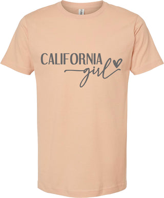 Peach t-shirt with 'California girl' text on a white background