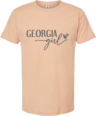 Peach t-shirt with 'Georgia girl' text on a white background