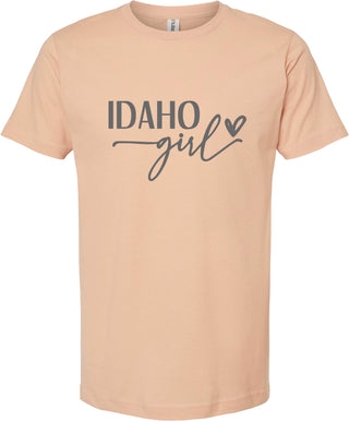 Peach t-shirt with 'Idaho Girl' text on a white background