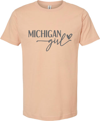 Peach t-shirt with 'Michigan girl' text on a white background