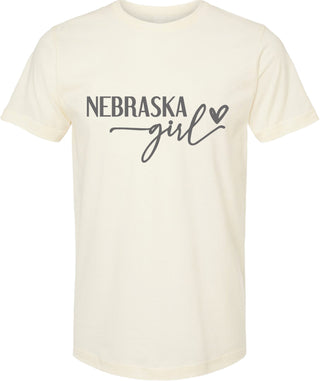 Cream t-shirt with 'Nebraska girl' text on a white background