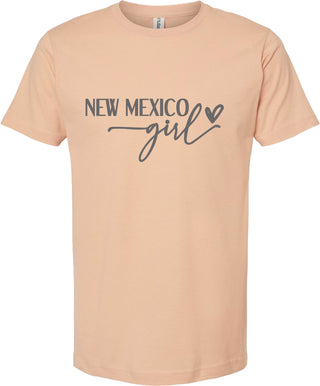 Peach t-shirt with 'New Mexico Girl' text on a white background