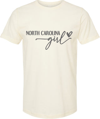 Cream t-shirt with 'North Carolina girl' text on a white background
