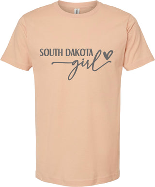 Peach t-shirt with 'South Dakota girl' text on a white background