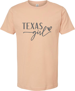 Peach t-shirt with 'Texas girl' text on a white background