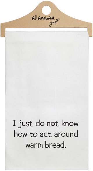 White towel with printed text 'I just do not know how to act around warm bread.' printed in black ink.
