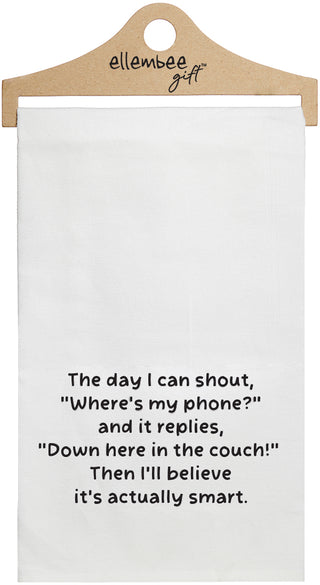 White towel with the text 'The day I can shout, "Where's my phone?" and it replies, "Down here in the couch!" Then I'll believe it's actually smart.' printed in black ink.