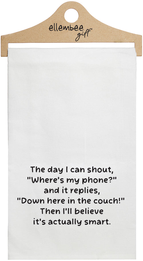 White towel with the text 'The day I can shout, "Where's my phone?" and it replies, "Down here in the couch!" Then I'll believe it's actually smart.' printed in black ink.