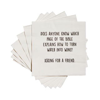 A stack of white 3-ply cocktail napkins printed in black with "Does anyone know which page of the Bible explains how to turn water into wine? Asking for a friend."