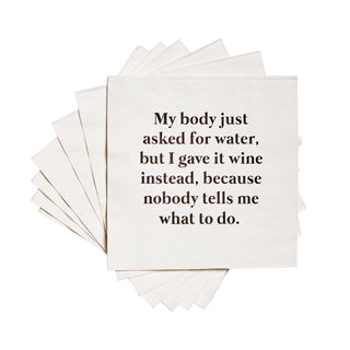 A stack of white 3-ply cocktail napkins printed in black with "My body asked for water, but I gave it wine instead, because nobody tells me what to do."