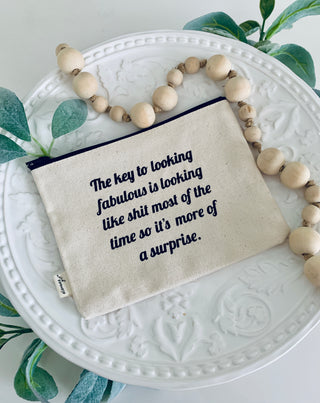 The 'looking fabulous' makeup bag shown styled with cosmetics and beauty essentials.