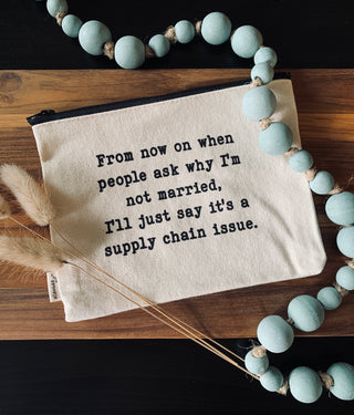 The supply chain issue zipper pouch shown styled with decorative beads.
