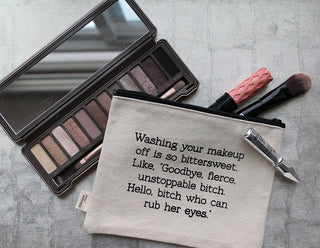 Lifestyle view of the "fierce unstoppable bitch" canvas makeup bag.