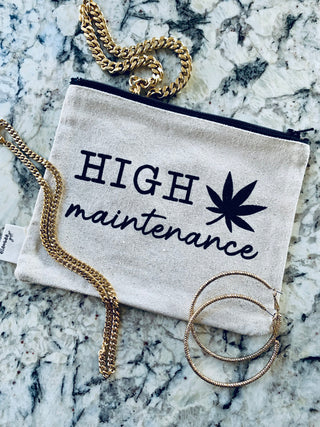 Lifestyle shot of the "high maintenance" canvas zipper pouch.