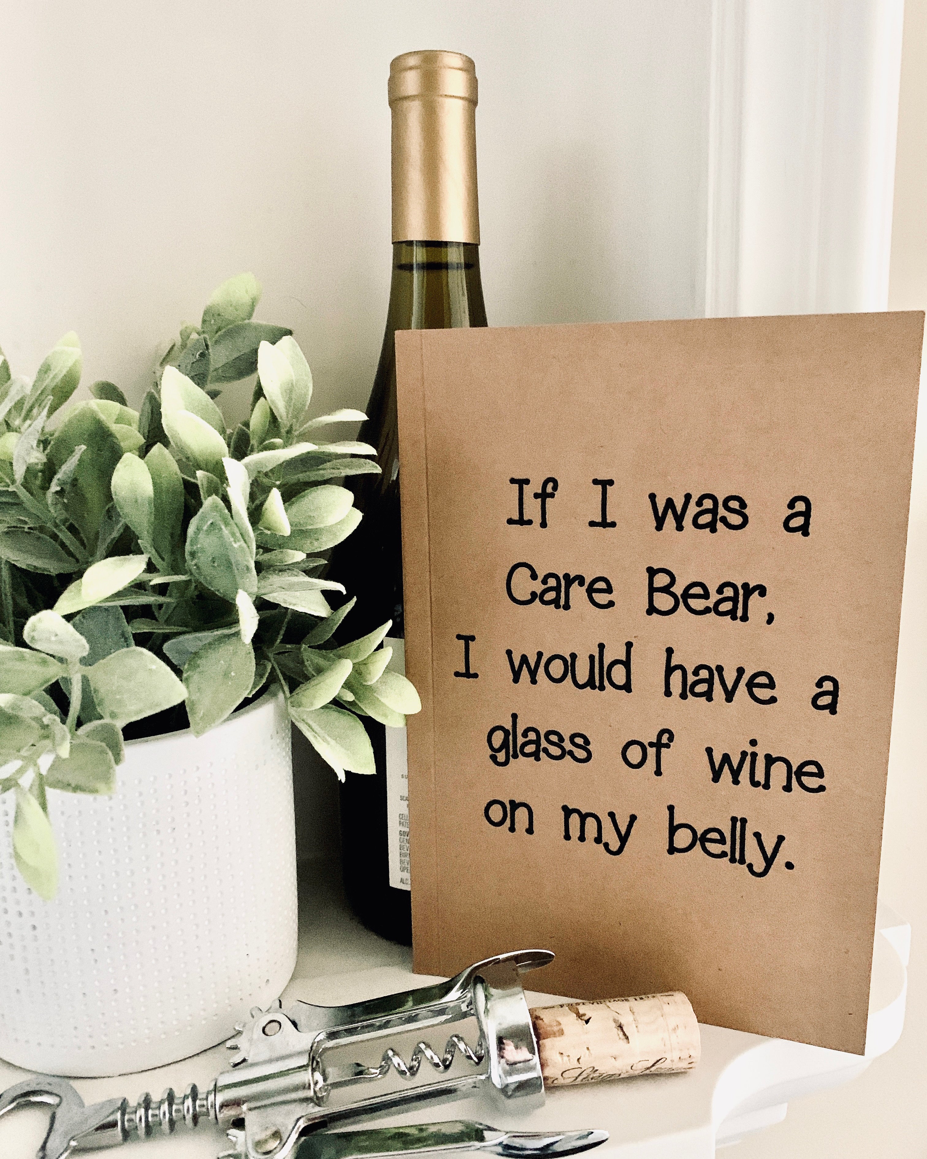 If I was a care bear, I'd have a glass of wine on my belly kraft notebook