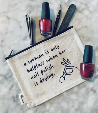 Lifestyle shot of the "nail polish" canvas makeup bag.