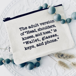 Lifestyle shot of the "wallet, glasses, keys, and phone" canvas zipper pouch.