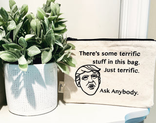 Lifestyle shot of the Donald Trump "terrific stuff" canvas zipper pouch.