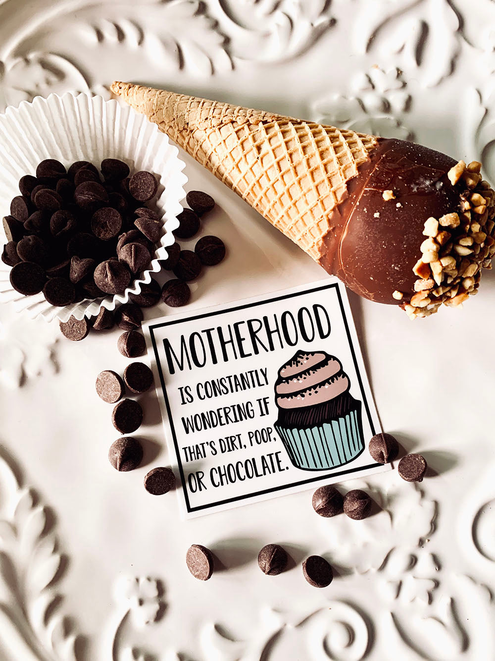 Motherhood is constantly wondering if that's dirt, poop, or chocolate vinyl sticker
