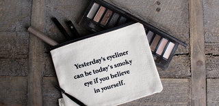 Lifestyle shot of the "smoky eye" canvas makeup bag.